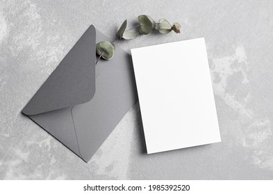 Greeting Or Wedding Invitation Card Mockup With Envelope And Dry Eucalyptus Twig, Top View, Copy Space