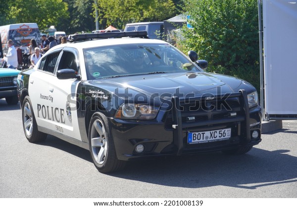 Grefrath,Germany-August\
28,2022: 2011-2014 Dodge Charger LX as Police Car at Grefrath US\
Cars show 2022,is second generation  of a full-size sedan by the US\
manufacturer Dodge from\
2010