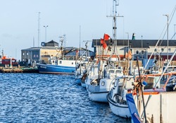 GRENAA, DENMARK - December 25, 2023: Fishing Vessels In Grenaa Harbor In  Denmark. Screaming Seagulls, Fishing Boats, Ferries, Sharks In Tropical Pools, Good Restaurants.