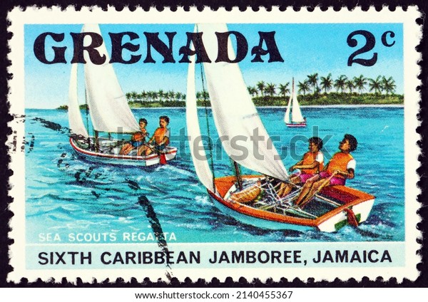 GRENADA - CIRCA 1977: a stamp printed in Grenada\
shows boy scout regatta, 6th Caribbean Jamboree, Kingston, Jamaica,\
circa 1977