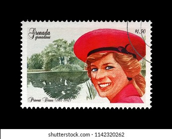 GRENADA, GRENADINES - CIRCA 1997: Canceled Stamp Printed In Grenada Dedicated To The Memory Of Diana, Princess Of Wales, Circa 1997. Lady Di In Red Hat. Vintage Post Stamp Isolated On Black Background