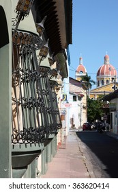 GRENADA, NICARAGUA - CIRCA JANUARY 2013: Street scene with view of Granada Cathedral. Originally dating back to 1583 and rebuilt many times