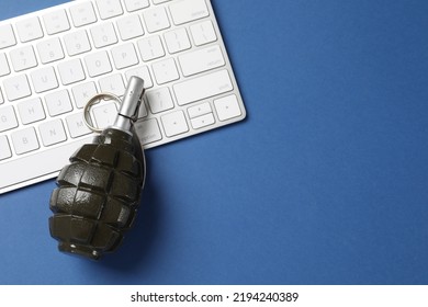 Grenade And Computer Keyboard On Blue Background, Flat Lay With Space For Text. Hybrid Warfare Concept