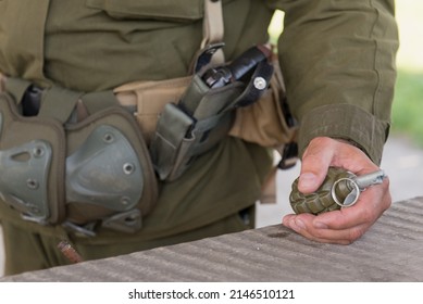 Grenade In Hand On Woman Military Training. Practicing With Dangerous Weapon Outdoors. Real People In Army