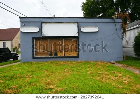 An grey abandoned store front