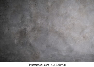 Grey background. Abstract grunge stained canvas texture. 