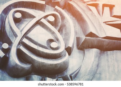 Grey bas with an abstract pattern, background in the sunlight