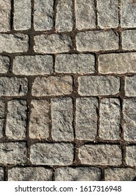 Grey Belgian Block Brick In The Ground.