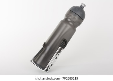 Grey Bike Water Bottle Inserted To Holder, Studio Photo, Isolated On White Background