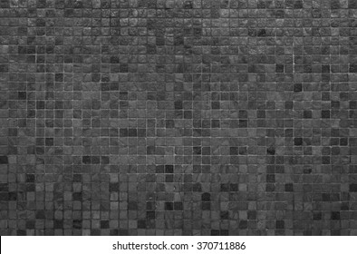 Grey and black mosaic wall texture and background