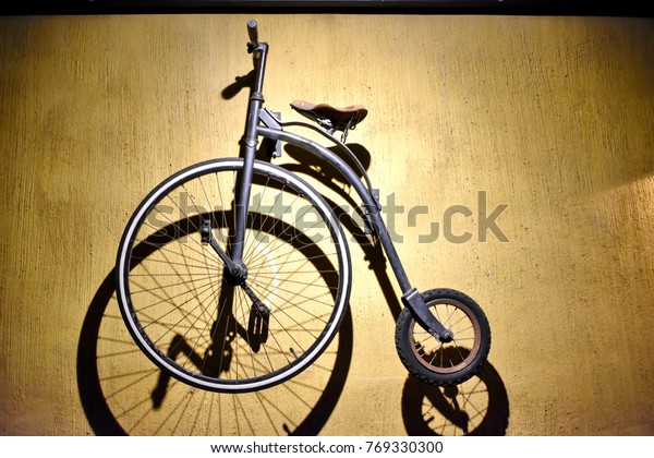 big front wheel small back wheel bike