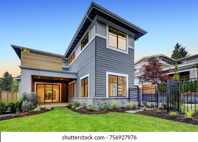 Grey Blue Craftsman Style Home Exterior With Beautifully Layered Landscaping. Northwest, USA