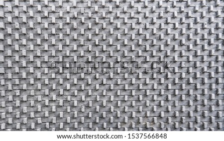 Grey brick arranged in three dimensional wall for outdoor decoration as illusional pattern.