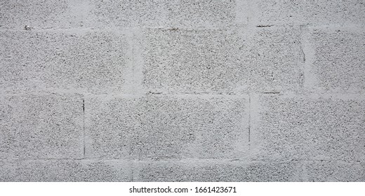 Grey brick cinder block wall background concrete tile cladding seamless texture