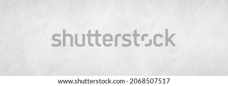 Grey brush paint limestone texture background in white light marble wall paper. Back wide concrete stone table tops view floor plaster pattern granite bacground surface seamless grunge wide panorama.