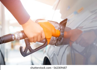 Grey car at gas station being filled with fuel on thailand - Shutterstock ID 562309687