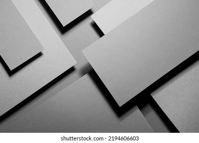 Grey carbon abstract geometric background with soar rectangle surfaces with corners, stripes in hard light, black shadows - monochrome style backdrop in elegant simple modern minimal style, top view.