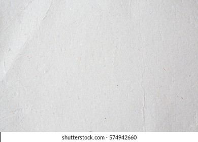 Grey Card Paper Kraft Texture With Crease Folded Photo Cardboard In White Light On Table Concept For Creative Art Simple Parchment Tear Background Design. Pattern Of Newspaper Surface For Dream Tone.