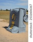 Grey cars stacked on top of each other in the middle of nowhere Nebraska as a tribute to Stonehenge in the U.K.