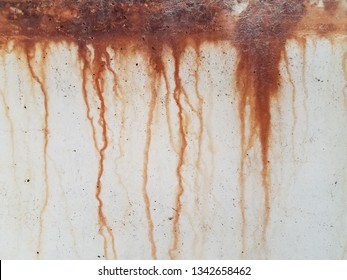 Grey Cement Wall With Red Rust Dripping Down