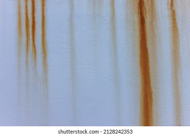 Grey Cement Wall With Red Rust Dripping Down