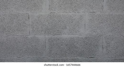 Grey cinderblock brick wall for background gray blockwork texture