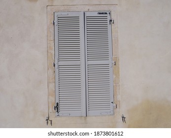 A Grey Closed Shutter At Pesmes.