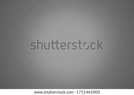 Grey color background texture with dark vignette. Gray blurred background abstract with copy space for design. 
