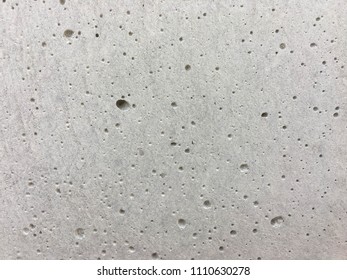 Grey Concrete Wall Texture Background With Bobble Or Hole On Surface