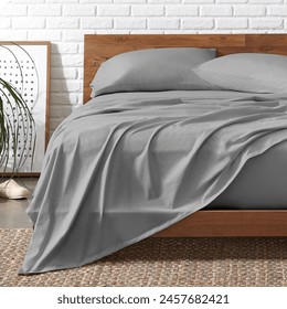 Grey Cotton Jersey Bed Sheet With 2 Pillow Wooden Bed and Classic View - Powered by Shutterstock