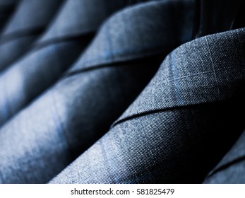 Grey Cotton Suit For Men Hanging On The Rack.