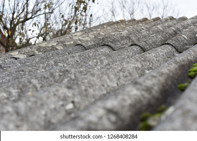 Grey dangerous asbestos roof, texture background