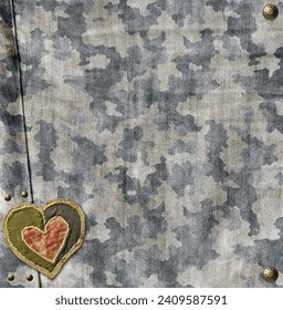 Grey denim background with camouflage denim jeans fabric texture, bronze buttons and felt heart. Valentine's day denim backdrop in camo style with old heart-shaped patch label. Copy space for text