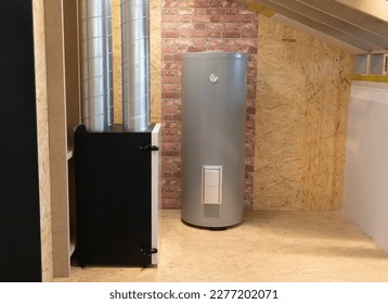 Grey Electric storage water heater with Temperature Display in utility room, brick wooden wall. Hi-Tech Capillary Thermostat. Safe, Environment Friendly system. Smart home, house. Horizontal