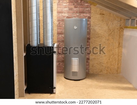 Grey Electric storage water heater with Temperature Display in utility room, brick wooden wall. Hi-Tech Capillary Thermostat. Safe, Environment Friendly system. Smart home, house. Horizontal