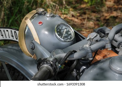 Grey German Wehrmacht BMW R75 Motorcycle Head Lamp And Speedometer Closeup.