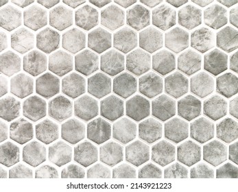 Grey hexagon marble tiles with white grout, Seamless interior decoration bavkground.