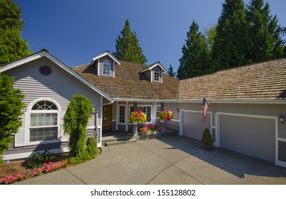 Grey House With Blue Sky And American Flag