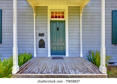 Grey house Entrance with green door. Amazing home from 1856 has never been touched since then. All details remain original. Lakewood, Washington State, US.
