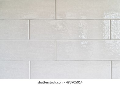 Grey Kitchen Backsplash Made With Rectangular Ceramic Tiles