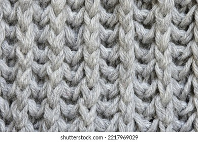 Grey Knitted Wool Texture. Knitted Elastic Band Pattern. Textured Background
