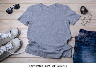 Grey Mens Cotton T-shirt Mockup With Black Watch, Jeans, Sport Shoes And Sunglasses. Design T Shirt Template, Tee Print Presentation Mock Up