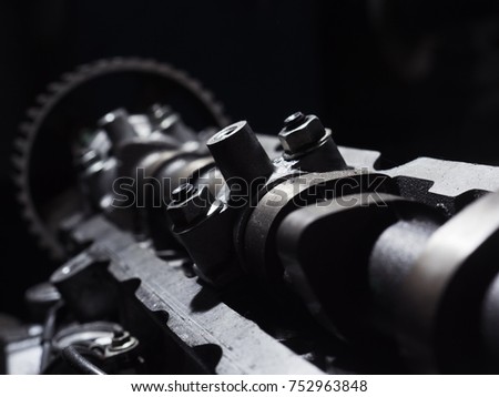 Grey metal car engine part.