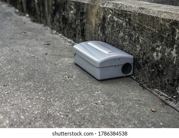 Grey Metal External Rodent Rat Bait Station Outside Against A Wall Close Up.  Pest Control.