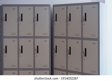 Grey Metal Lockers Storage Furniture In A Locker Room At School, Gym Or University.