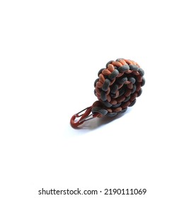 Grey and orange paracord bracelet  for emergency use.                             - Powered by Shutterstock