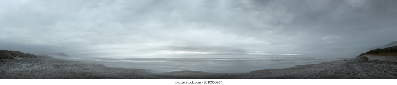 Grey overcast spring dusk at Cape Perpetua, Oregon Pacific Coast, long-exposure panorama - Shutterstock ID 2010350267