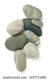 Grey pebbles isolated on white background. Grey sea stones with white stripes isolated on white. Studio shot.