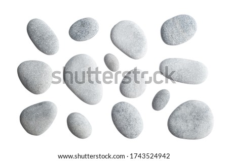 Grey pebbles isolated on white background.  Top view of sea stones
