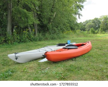 A Grey Peregrine Current Designs Kayak Alongside An Orange Kayak On The Banks Of The Wisconsin River Near Baraboo In Wisconsin In The United States In The Summer